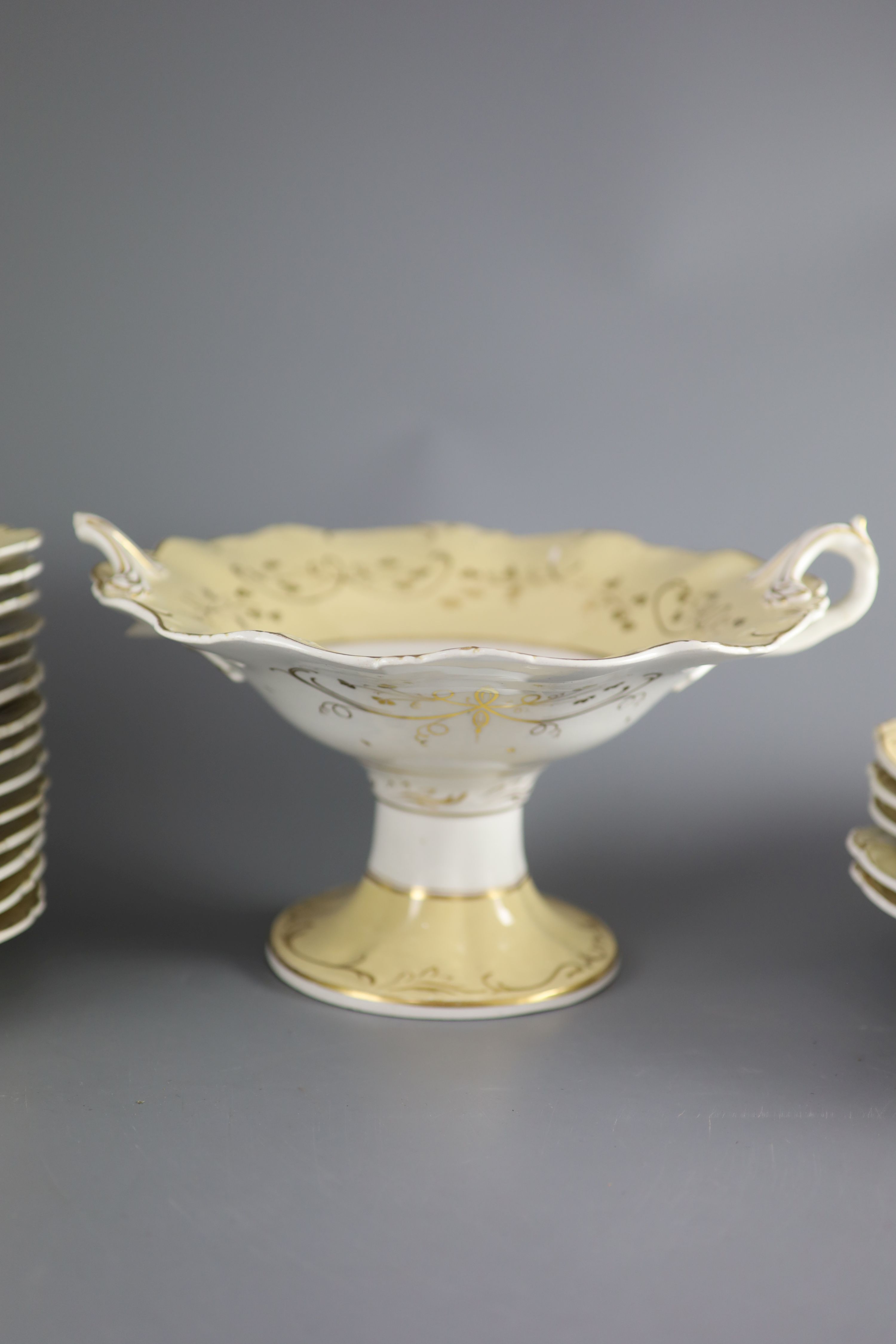 A Staffordshire cream and gilt twenty one piece part dessert service,